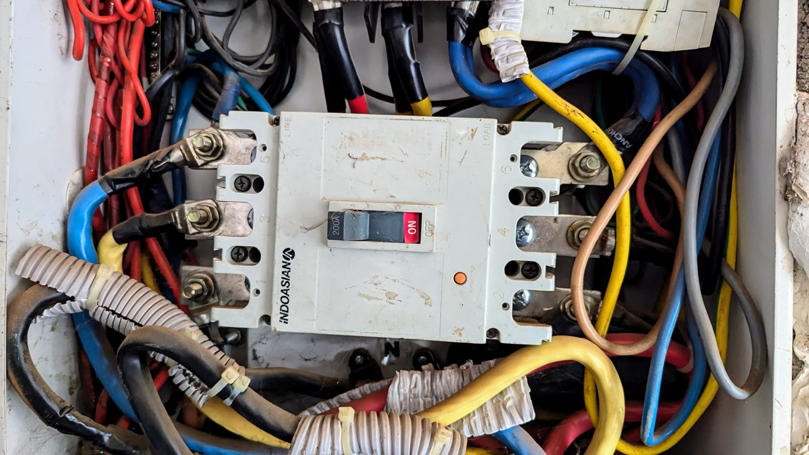 Close-up of breakers in a modern electrical panel as a cost reference